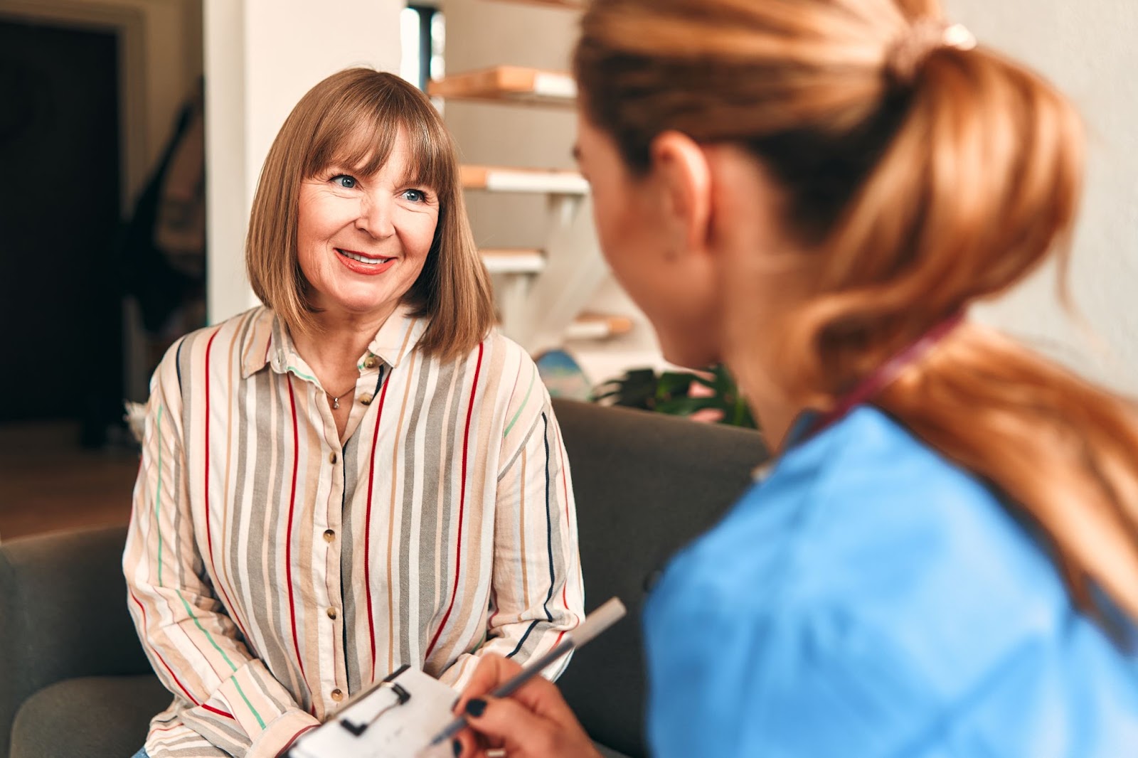 A provider at Spa 29 talking with an older female patient about her options for Frequent Urination Treatment in Brunswick, GA.