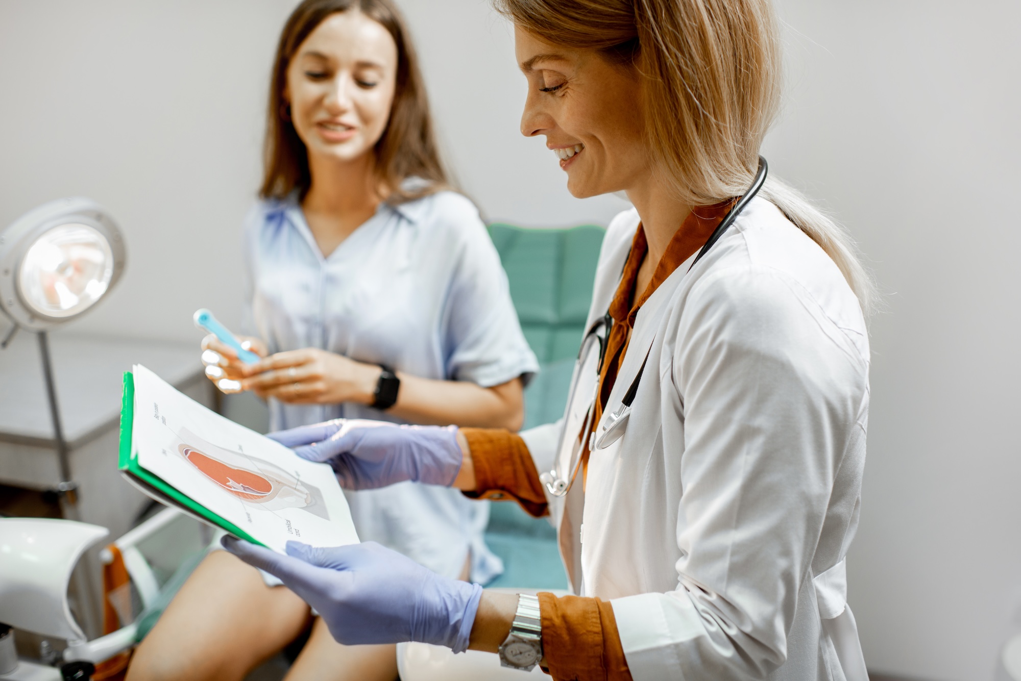 Provider at Spa 29 talking to a female patient about the pelvic floor and urinary incontinence treatment in Brunswick, GA.